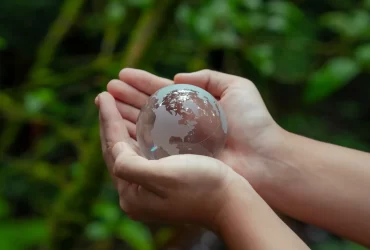 Crystal globe on hand. Environmental ESG concept. Society and Governance Sustainable global